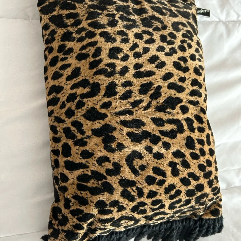Red Velvet Square Pillow with Gold Tassels plus a leopard pillow